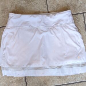 Athleta White Tennis Skort, specifically a‎ style featuring a sheer mesh layer